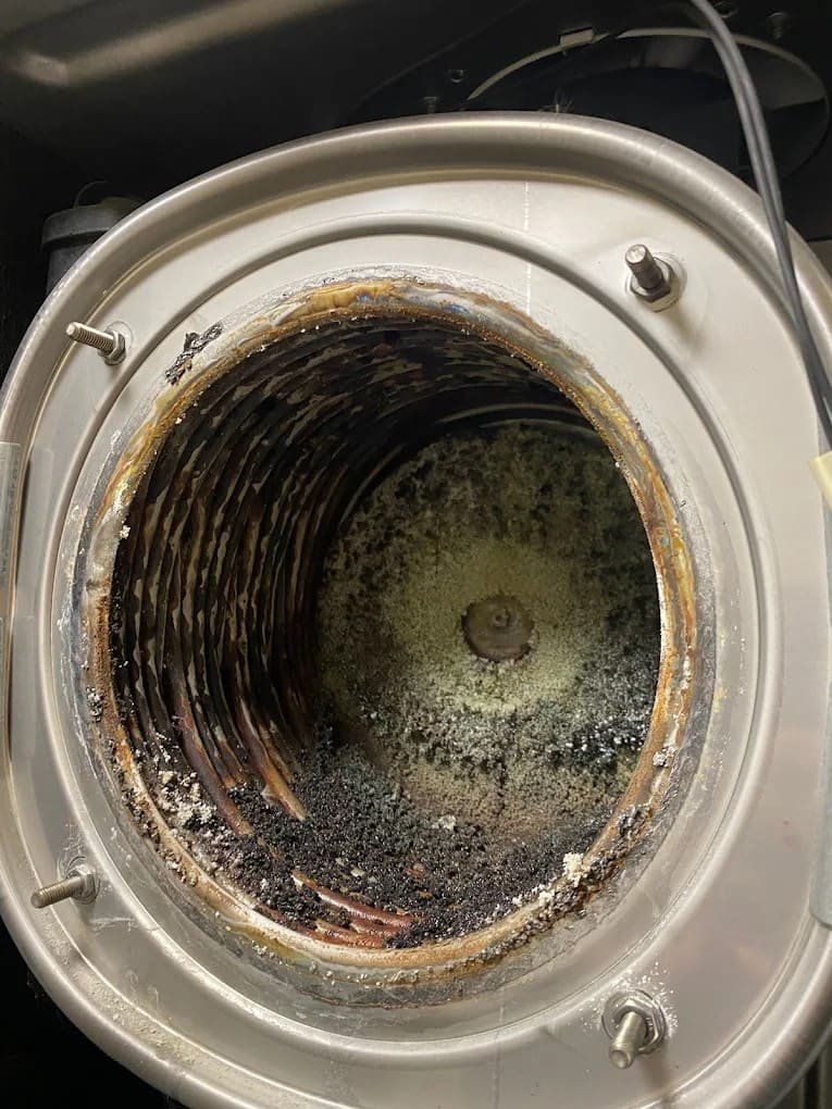 Dirty heat exchanger before professional boiler cleaning