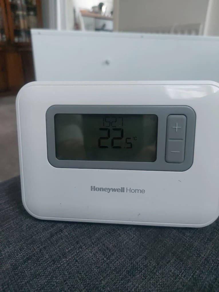 Honeywell Home smart thermostat set to 22 degrees