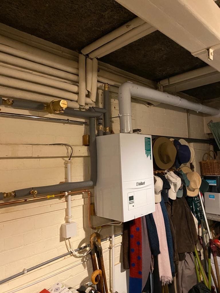 Vaillant wall-hung boiler with neat copper pipework in a utility room