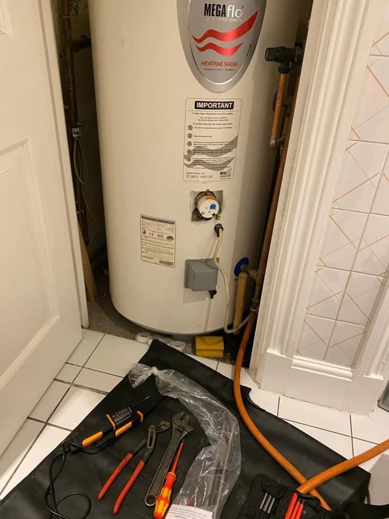 Unvented hot water cylinder installation in a London utility room