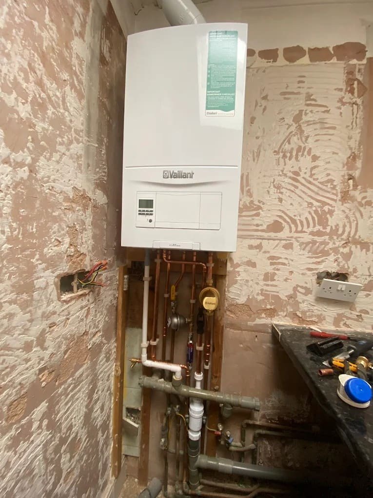 Vaillant system boiler installed on a brick wall in a London property